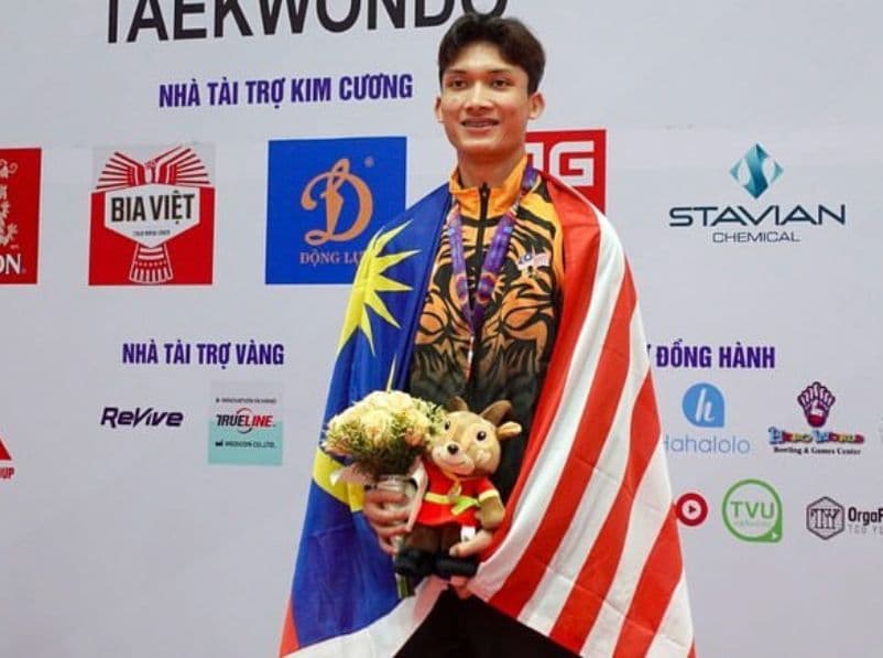 KIB team coach representing Malaysia at a Taekwondo event