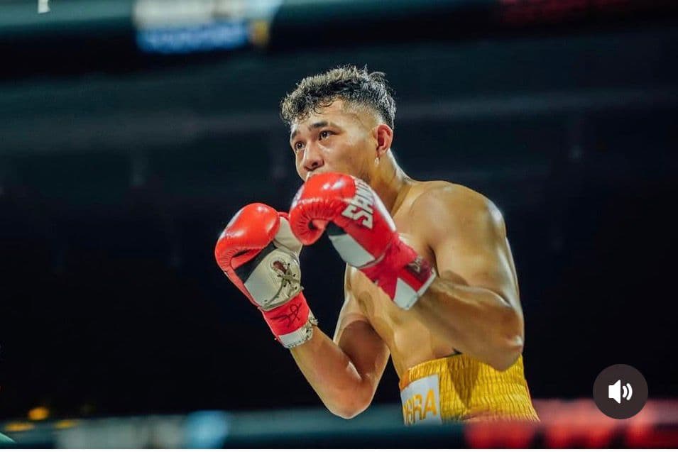 KIB coach competing in a boxing ring