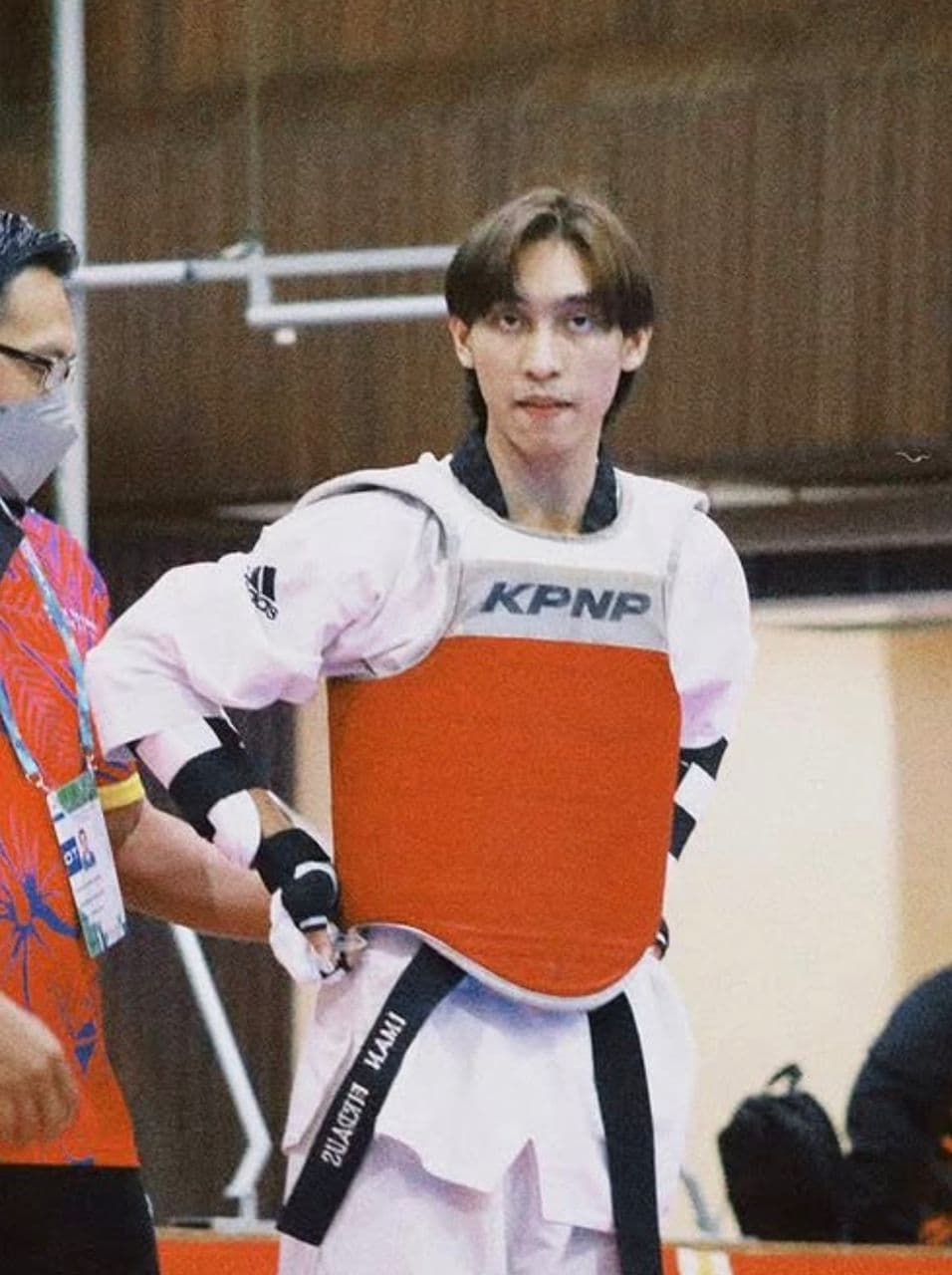 KIB admin and Taekwondo coach in competition gear