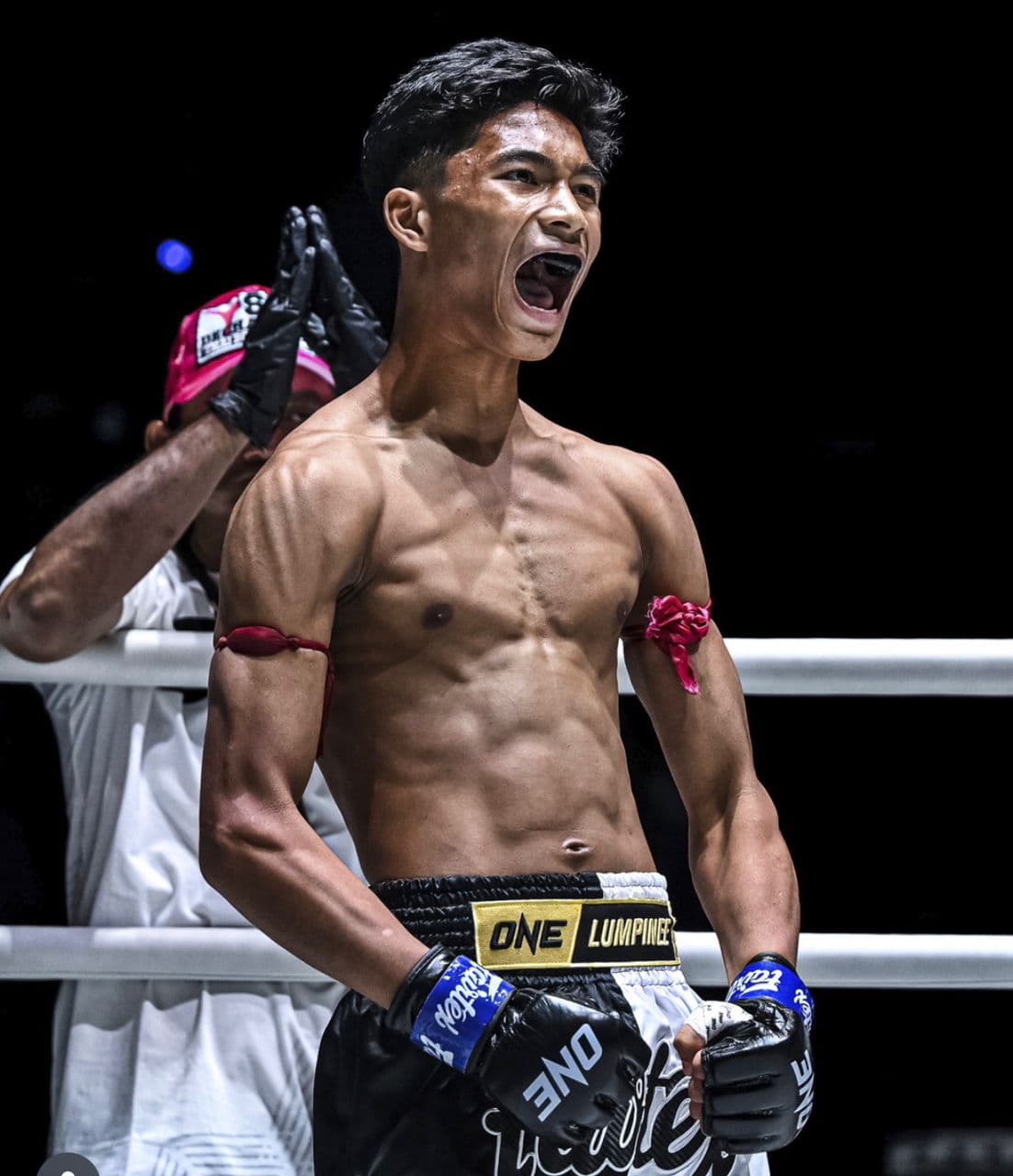 KIB Muaythai coach and fighter celebrating in the ring